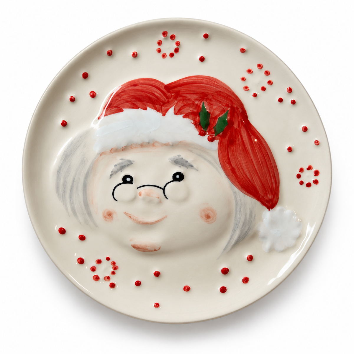 Mrs. Claus Dessert Plate — 19.5 cm

Bring a little Christmas charm to the table with Mrs. Claus. Handmade and hand-painted in Portugal, this earthenware dessert plate features her smiling face, delicate spectacles and a bright red hat with holly details. Raised red dots and a glossy cream finish complete the festive design.

Perfect for a slice of Christmas cake, holiday cookies or a sweet treat shared with family.

• Material: Earthenware
• Diameter: 19.5 cm
• Weight: Approximately 375 g
• Handmade